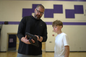 Teacher showing student IHT Classroom App heart rate data