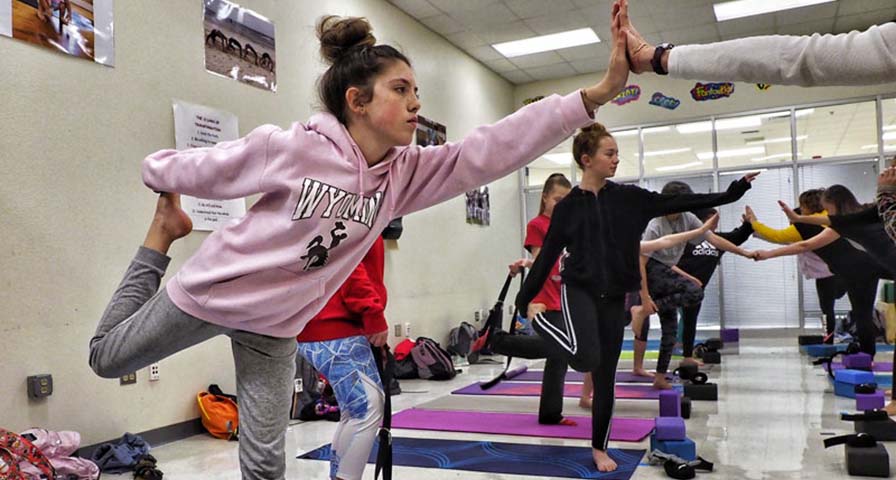 Middle School yoga class stretches beyond physical education requirements