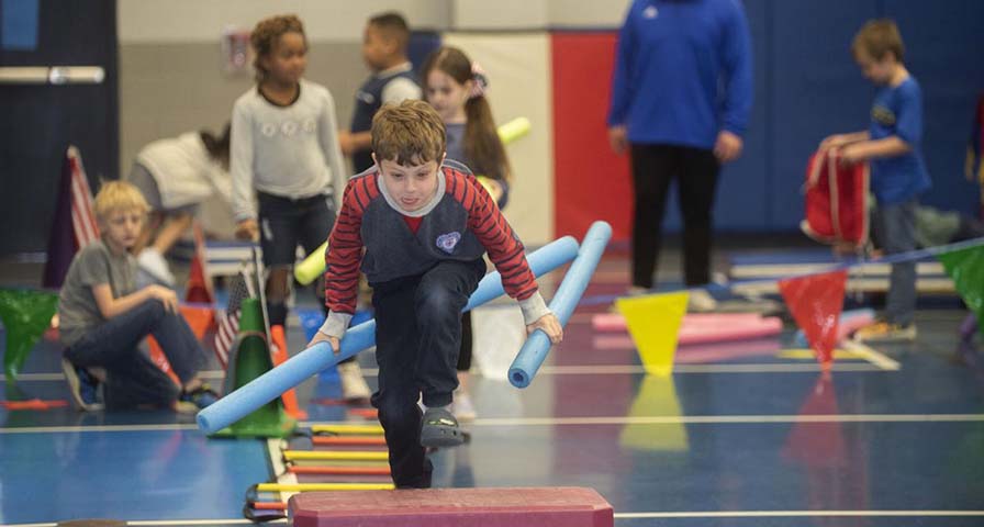 Gym transforms into Winter Olympics training area for students