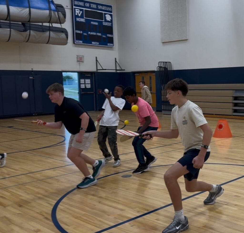 Students using heart rate monitors in PE